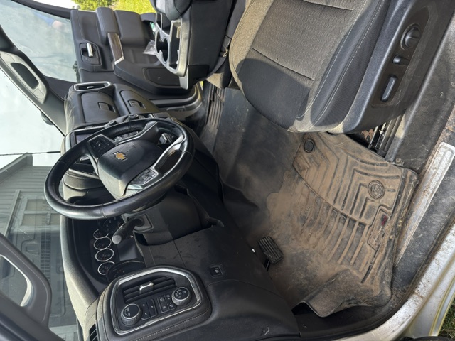 Truck interior before detailing — dirty floor mat and cabin